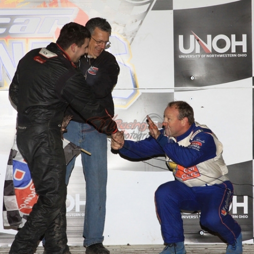NASCAR legend Ken Schrader bows to Ryan after Ryan beat Schrader with a last-lap pass at the UMP DIRTcar Nationals.
